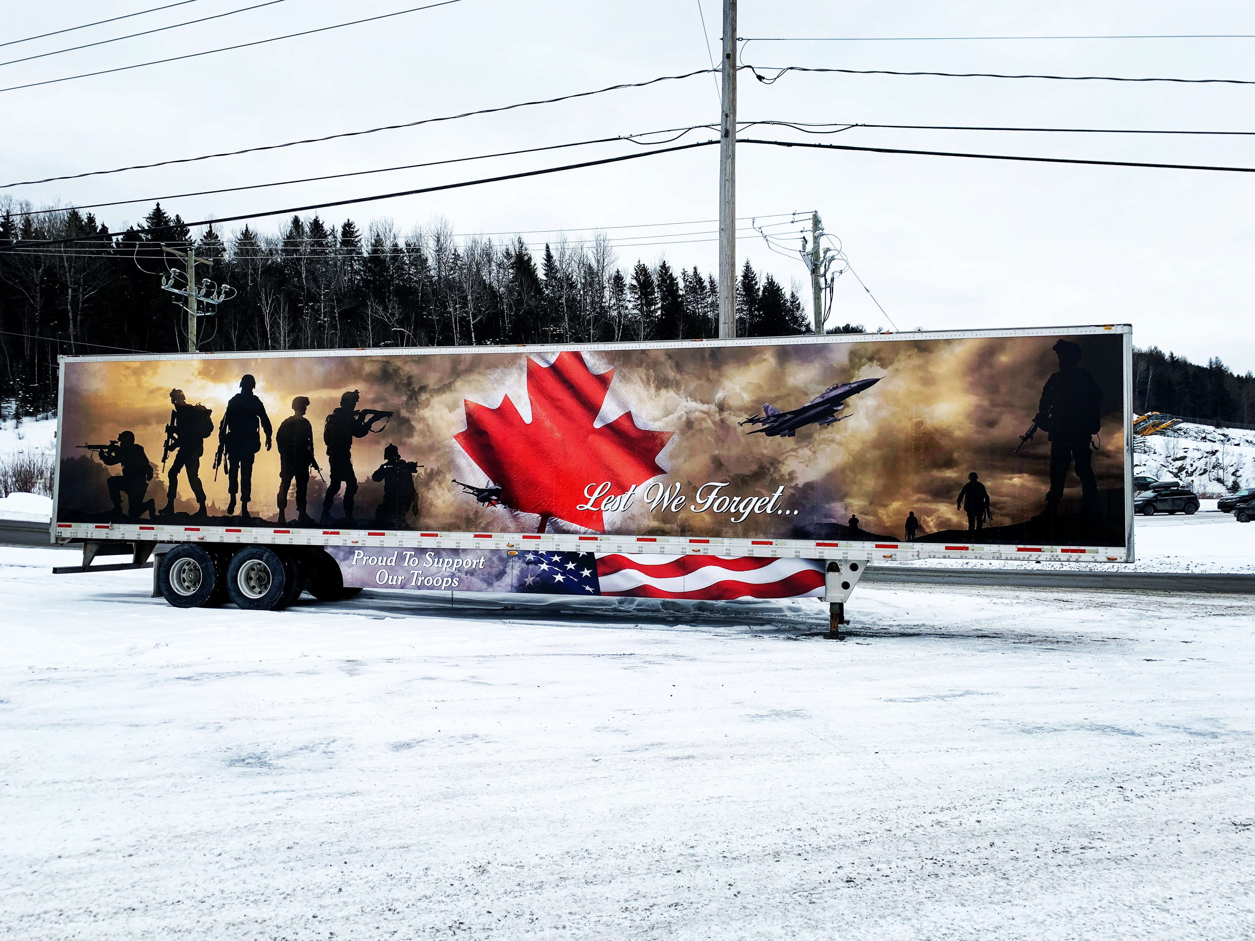 Trailer vinyl graphics with the design Lest we forget to support our troops by Turbo Images the leader in vehicle wrapping and trailer wraps so that your trailers will proudly represent your organization with their great wraps. For a great design and custom vinyl truck or trailer wrapping job, contact Turbo Images.